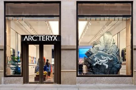 The Arc’teryx storefront, its glass doors and windows under the black sign