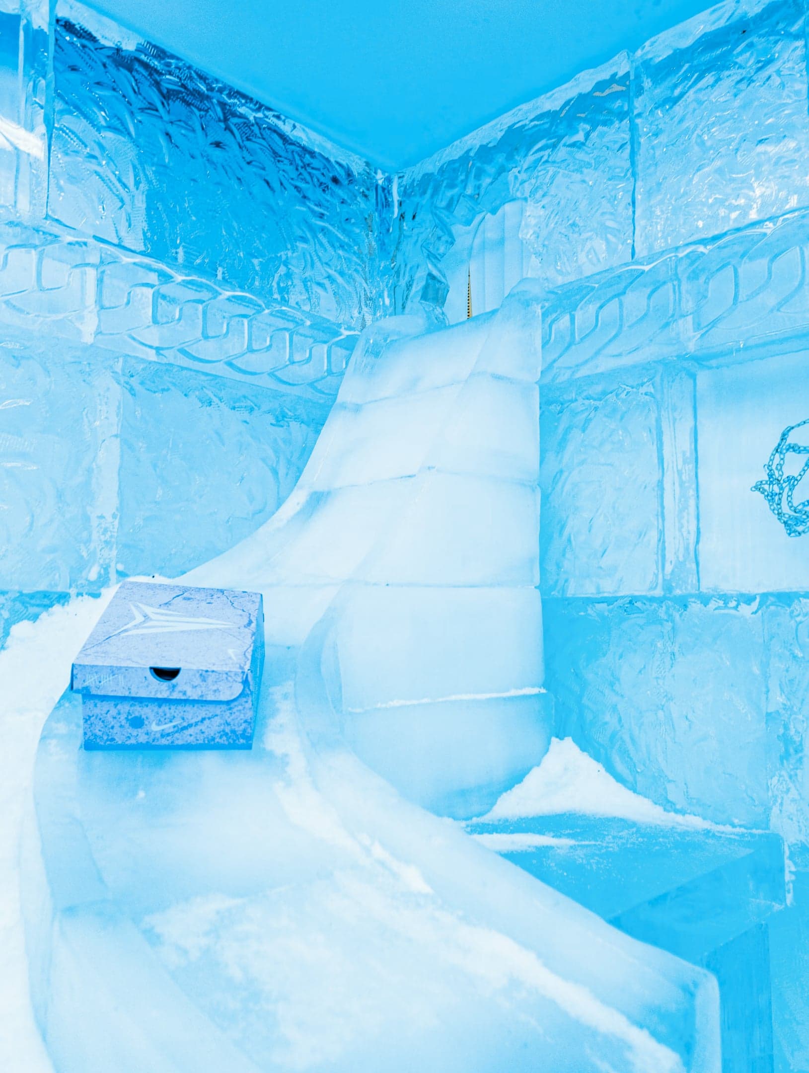 Inside the ice room: a snow ramp, a shoebox and a basketball hoop frozen in the wall