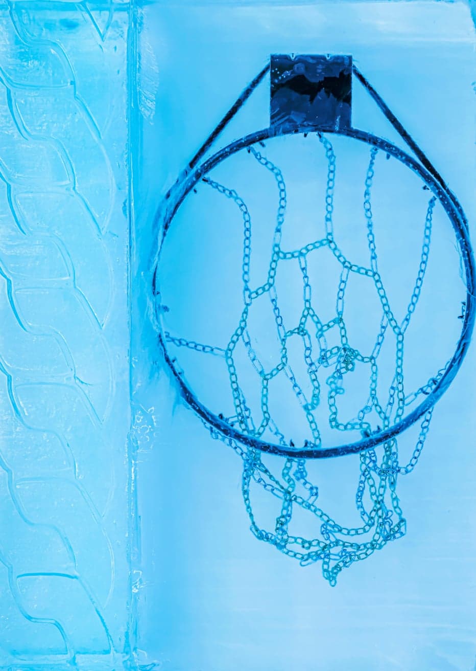 A basketball hoop frozen in an ice wall