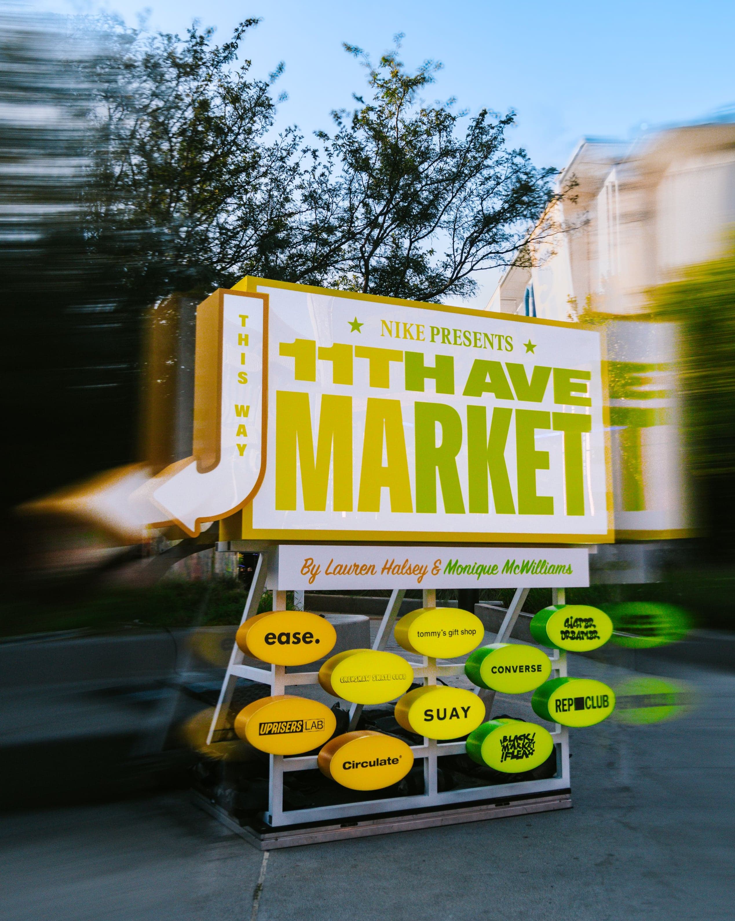 The 11th Ave Market sign, listing its vendors, at the night market entrance