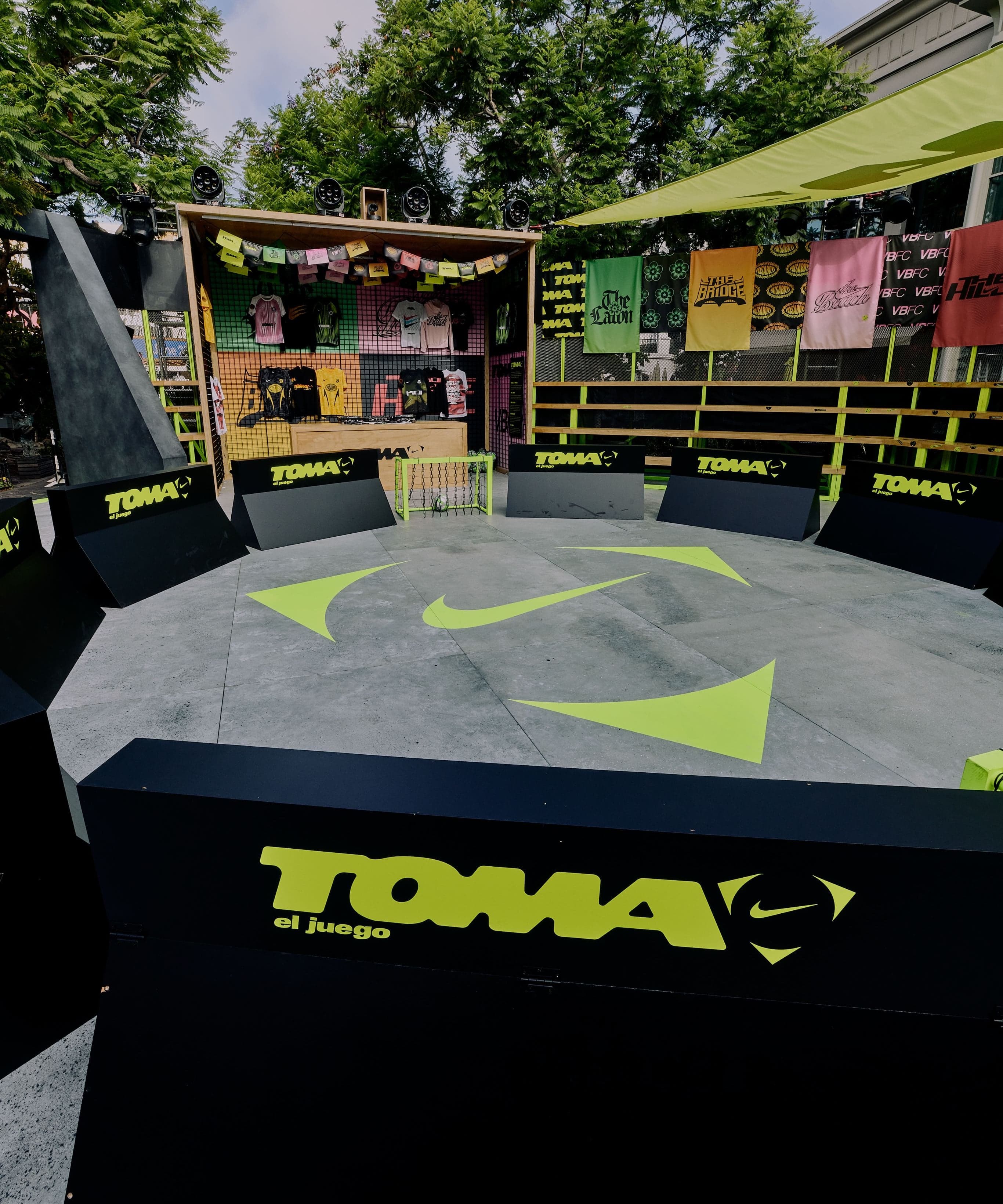 The TOMA pitch with a Nike swoosh and neon goal