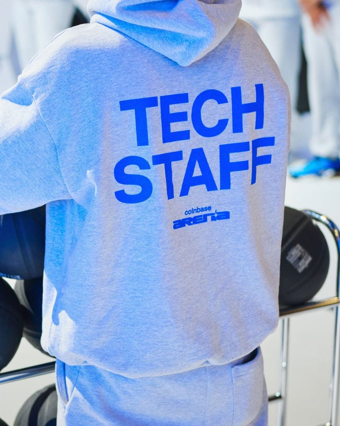 Back of a grey “Tech Staff” hoodie at Coinbase Arena