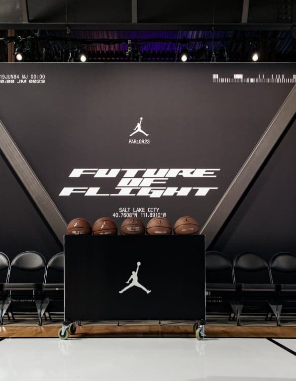 A “Future of Flight” screen with the Jumpman above a rack of basketballs on the court