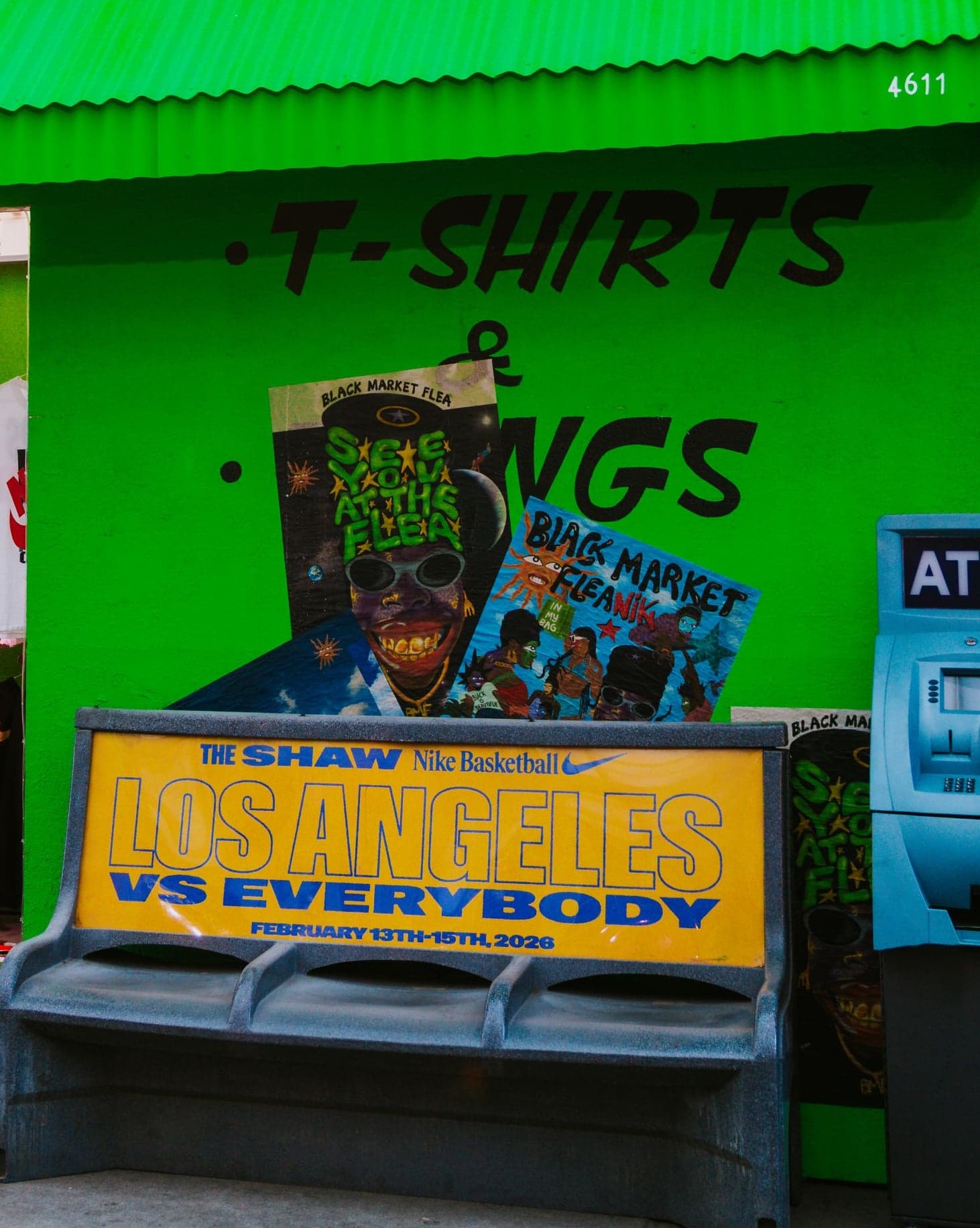 The Tees, Totes, Candles flea shop with a “Los Angeles vs Everybody” bench