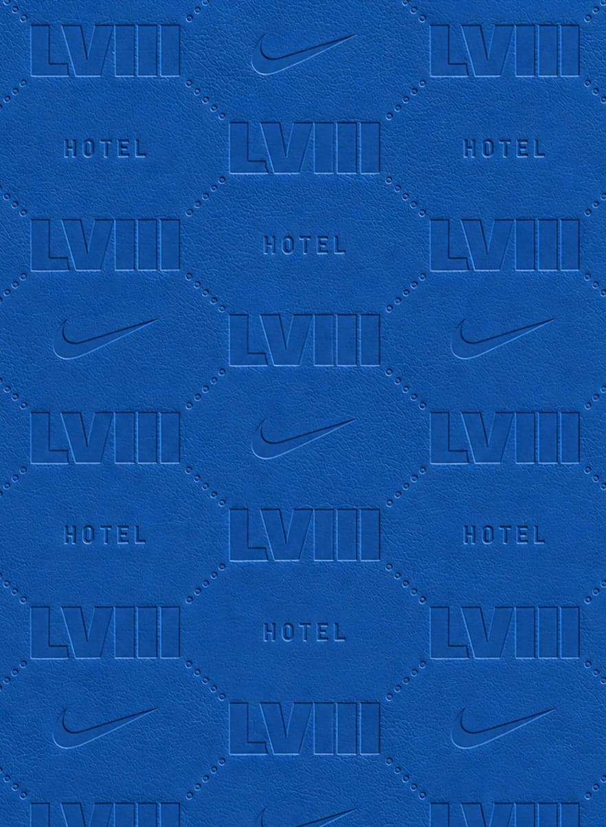 Blue leather embossed with a pattern of LVIII, Hotel and Nike swooshes