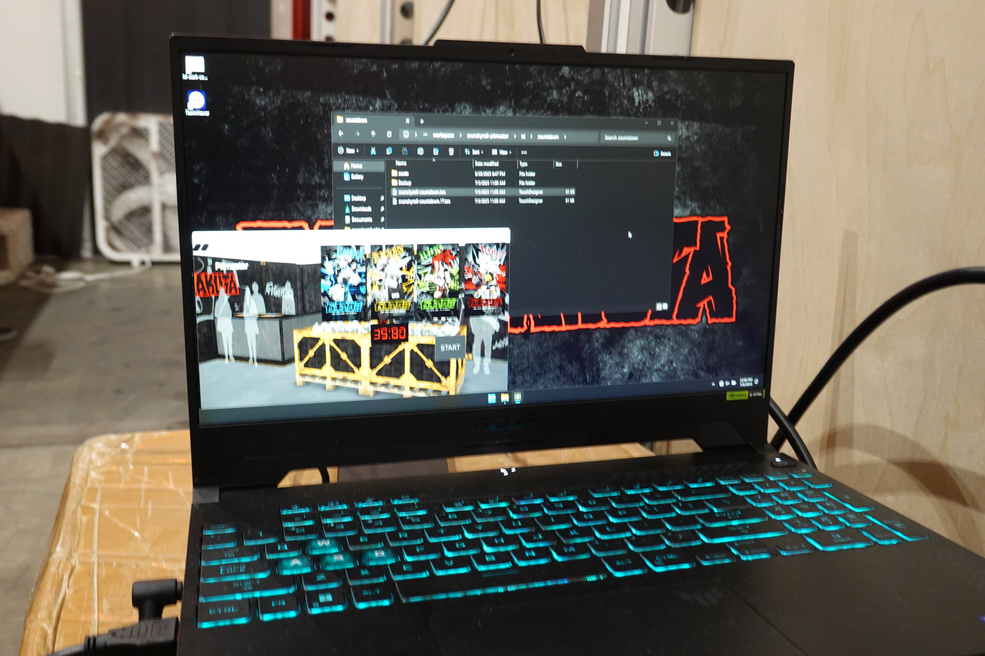 A laptop on site running the booth’s software, showing a render of the booth
