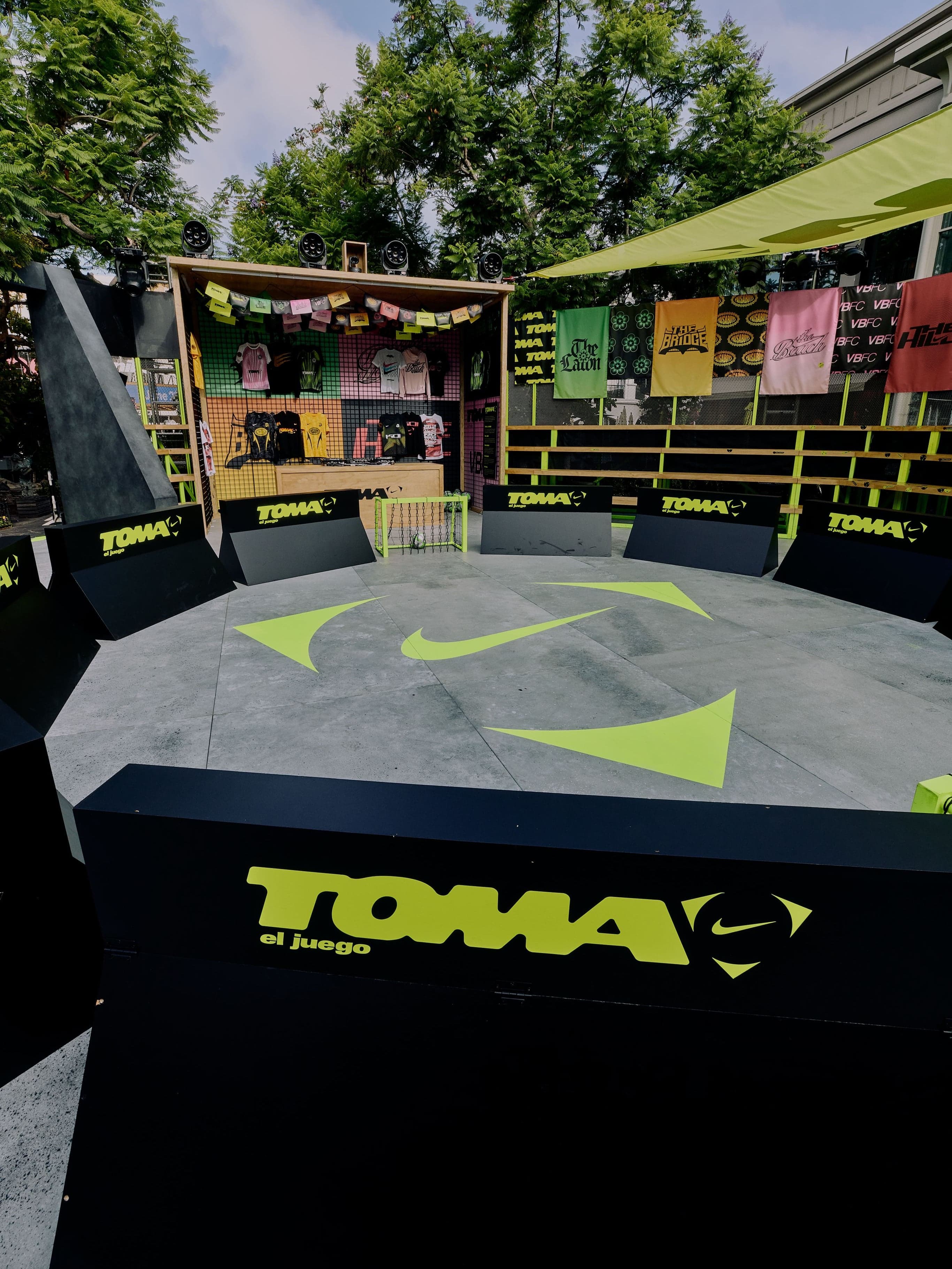 The TOMA pitch with a Nike swoosh and neon goal
