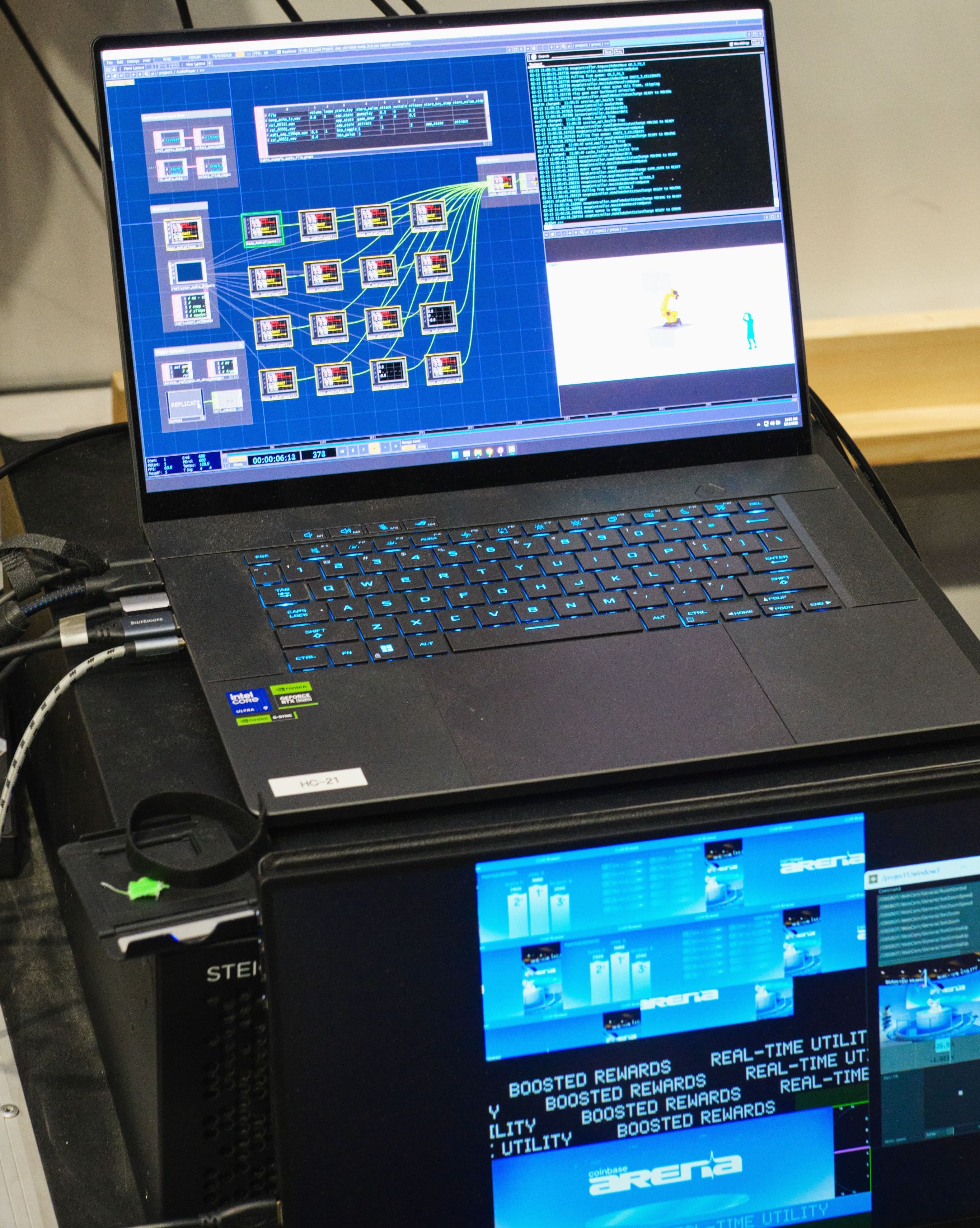 A laptop and monitors running the control software for the robotic hoop