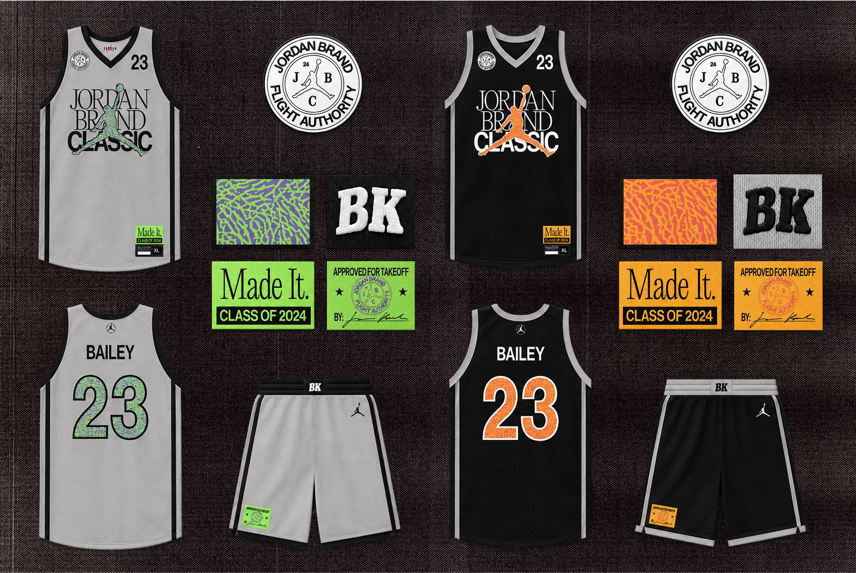 Flat-lay of gray and black Jordan Brand Classic jerseys and shorts with patches, labels and a flight authority seal on a dark texture
