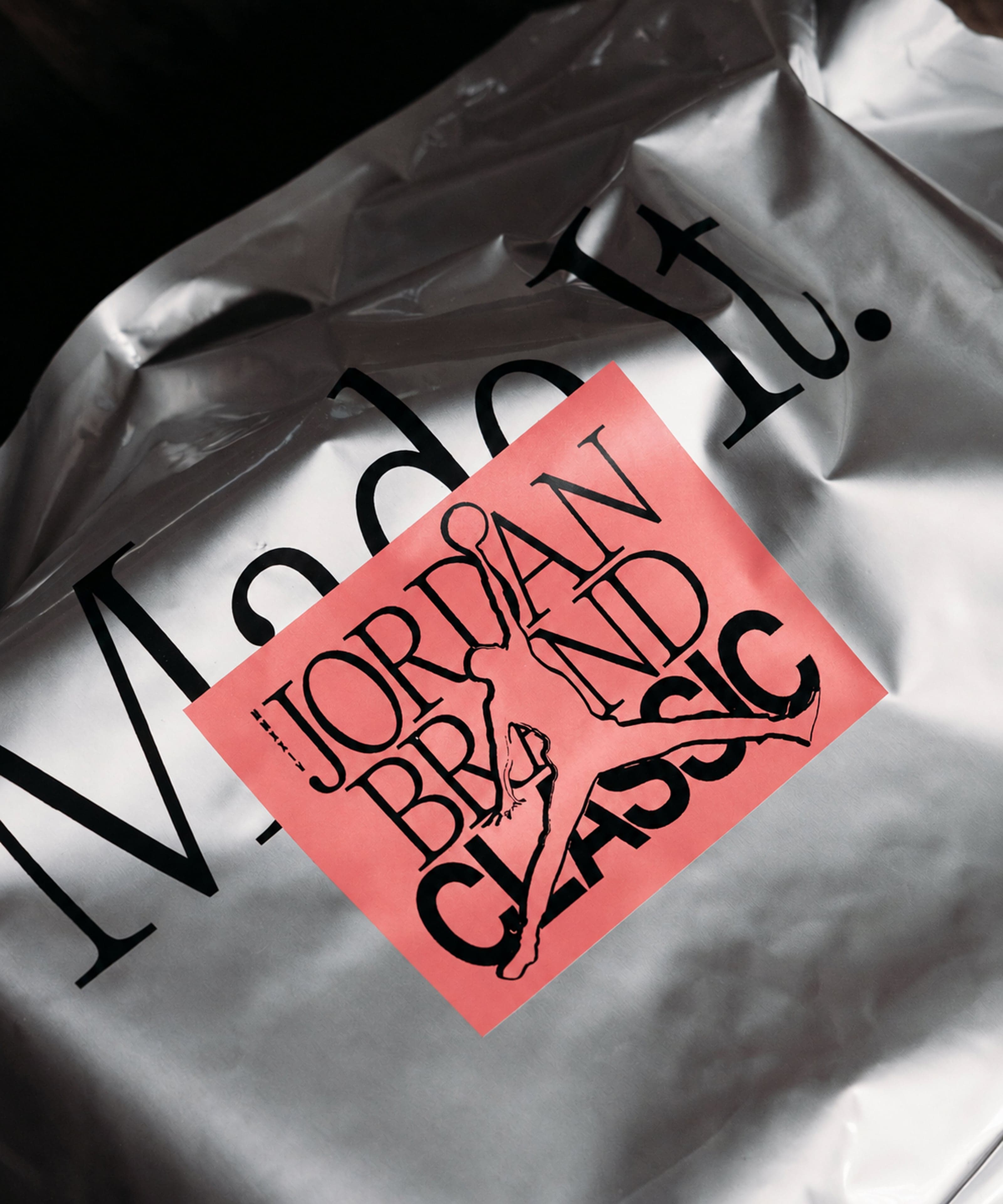 A silver foil bag with a salmon Jordan Brand Classic sticker