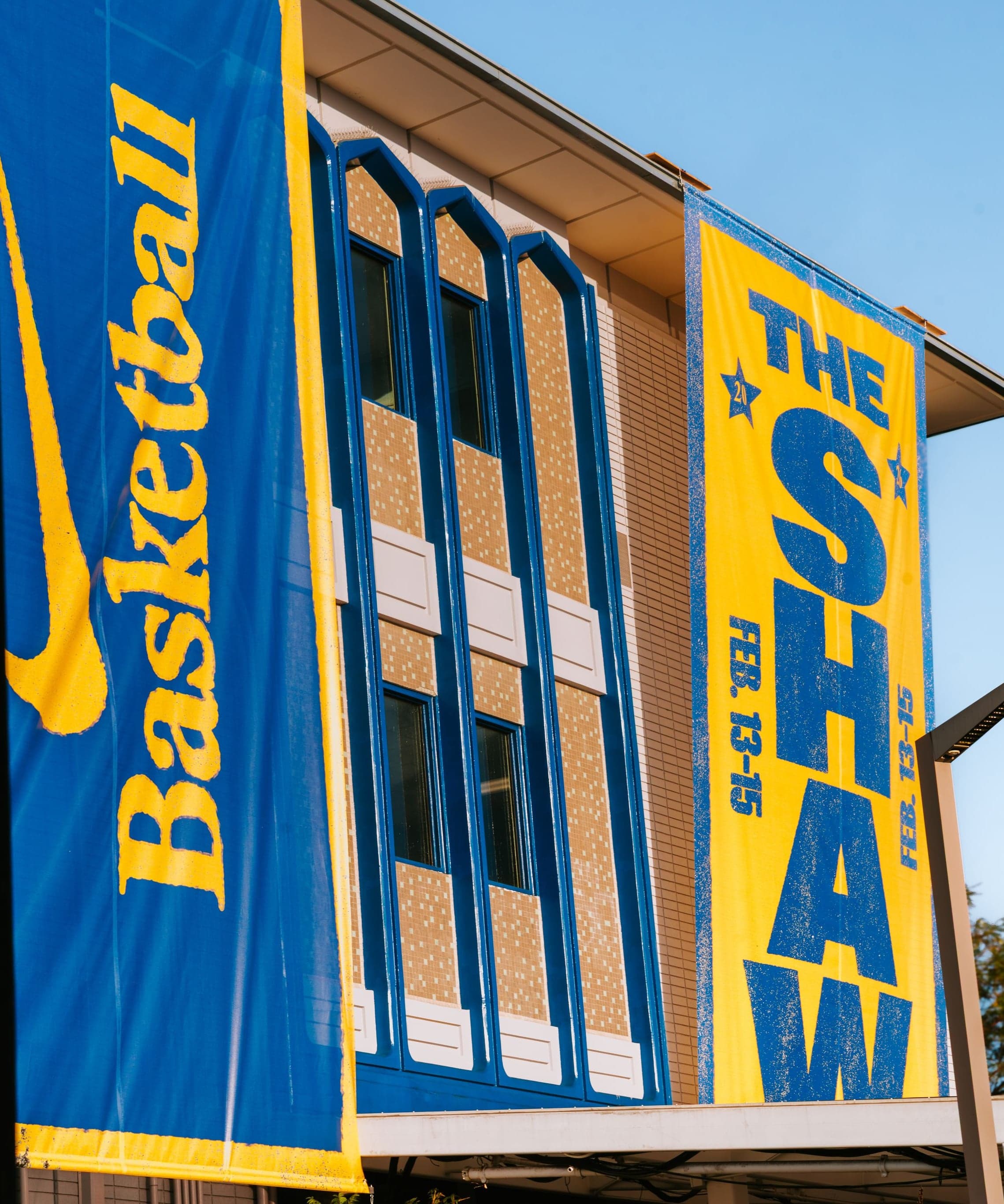 Nike Basketball and The Shaw banners on the school building