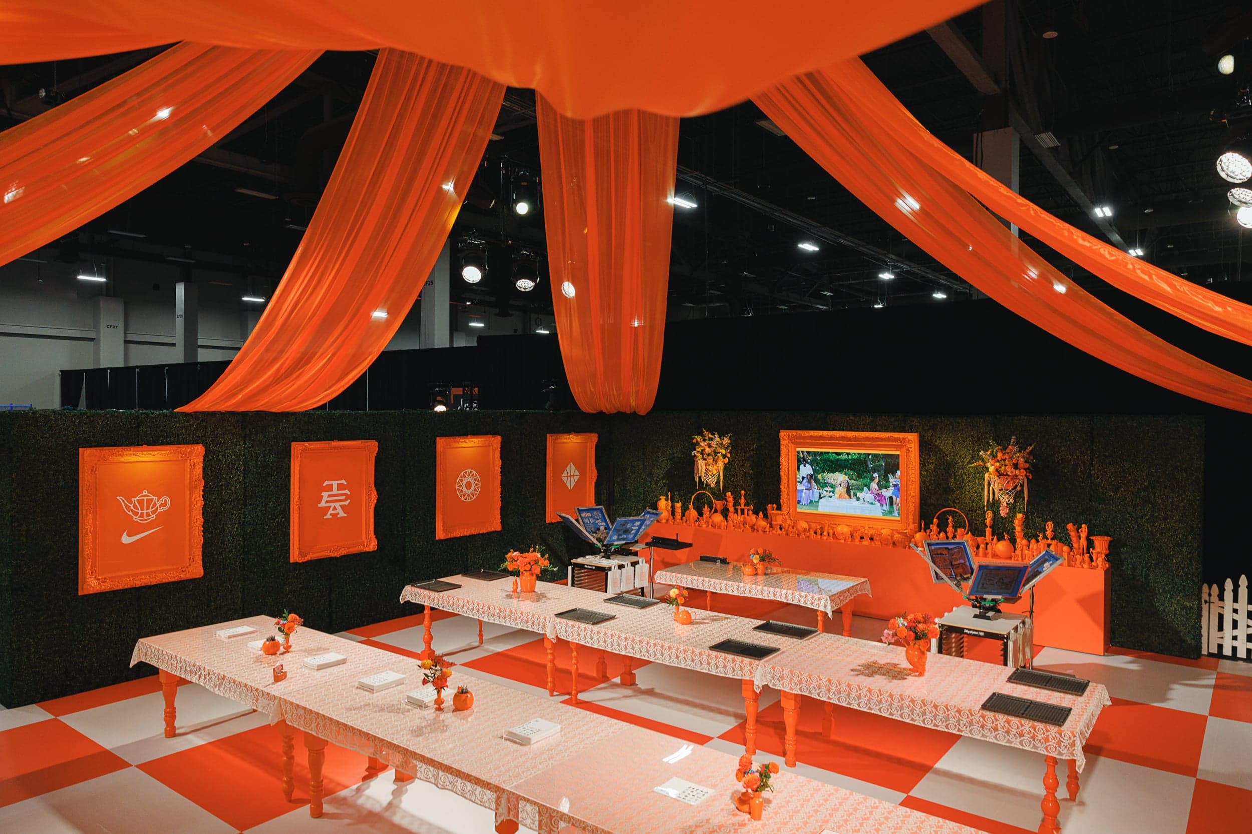 Customization tables under swags of orange drapes