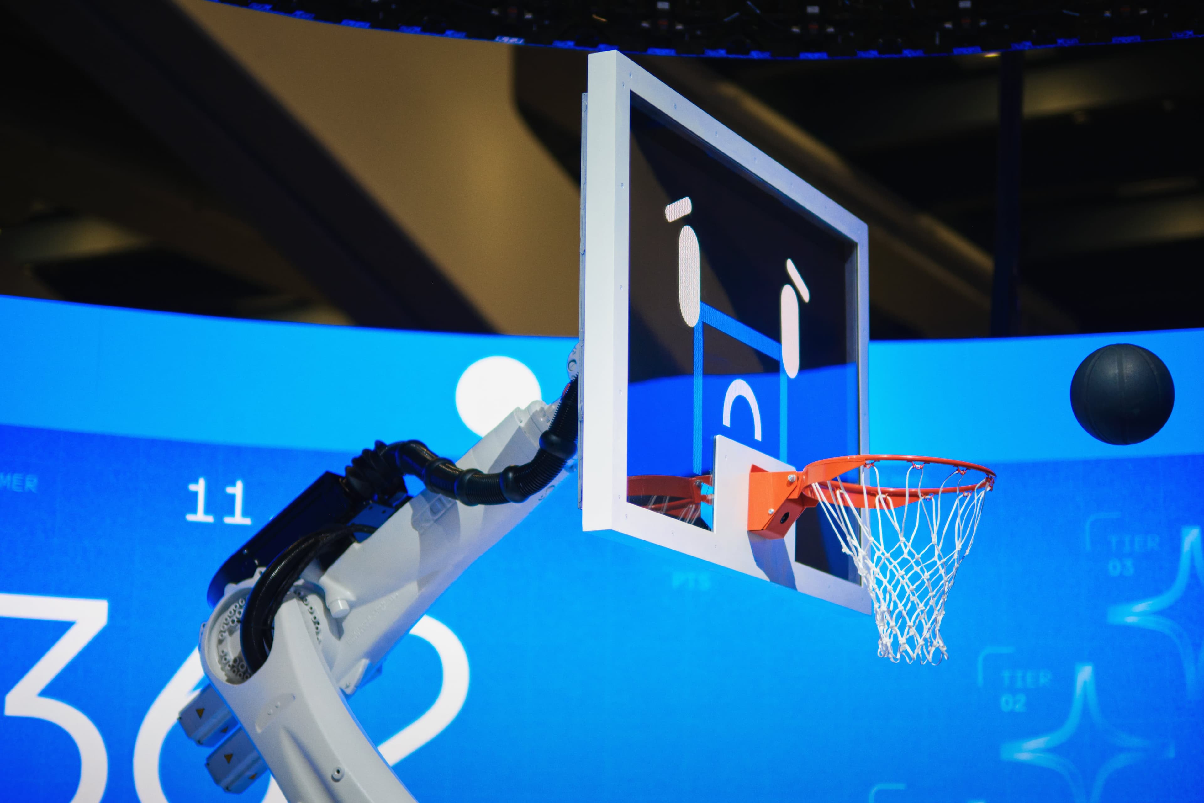 Close-up of the robotic arm holding the hoop and backboard