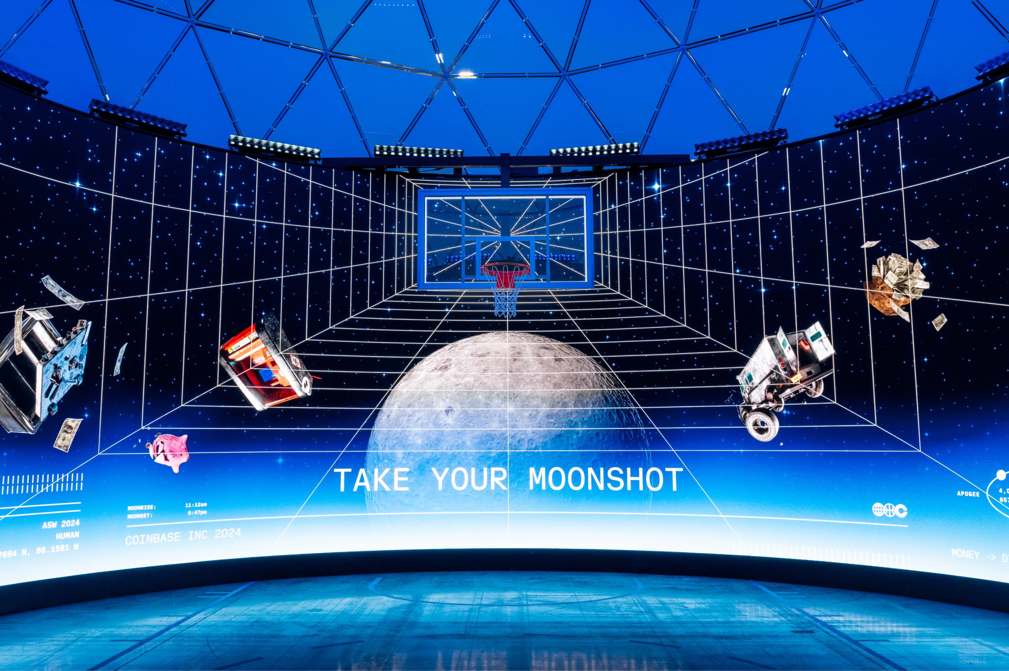 A space-themed room with a basketball hoop floating before a planet over a glowing grid floor, under a dome, with the words “Take your moonshot”