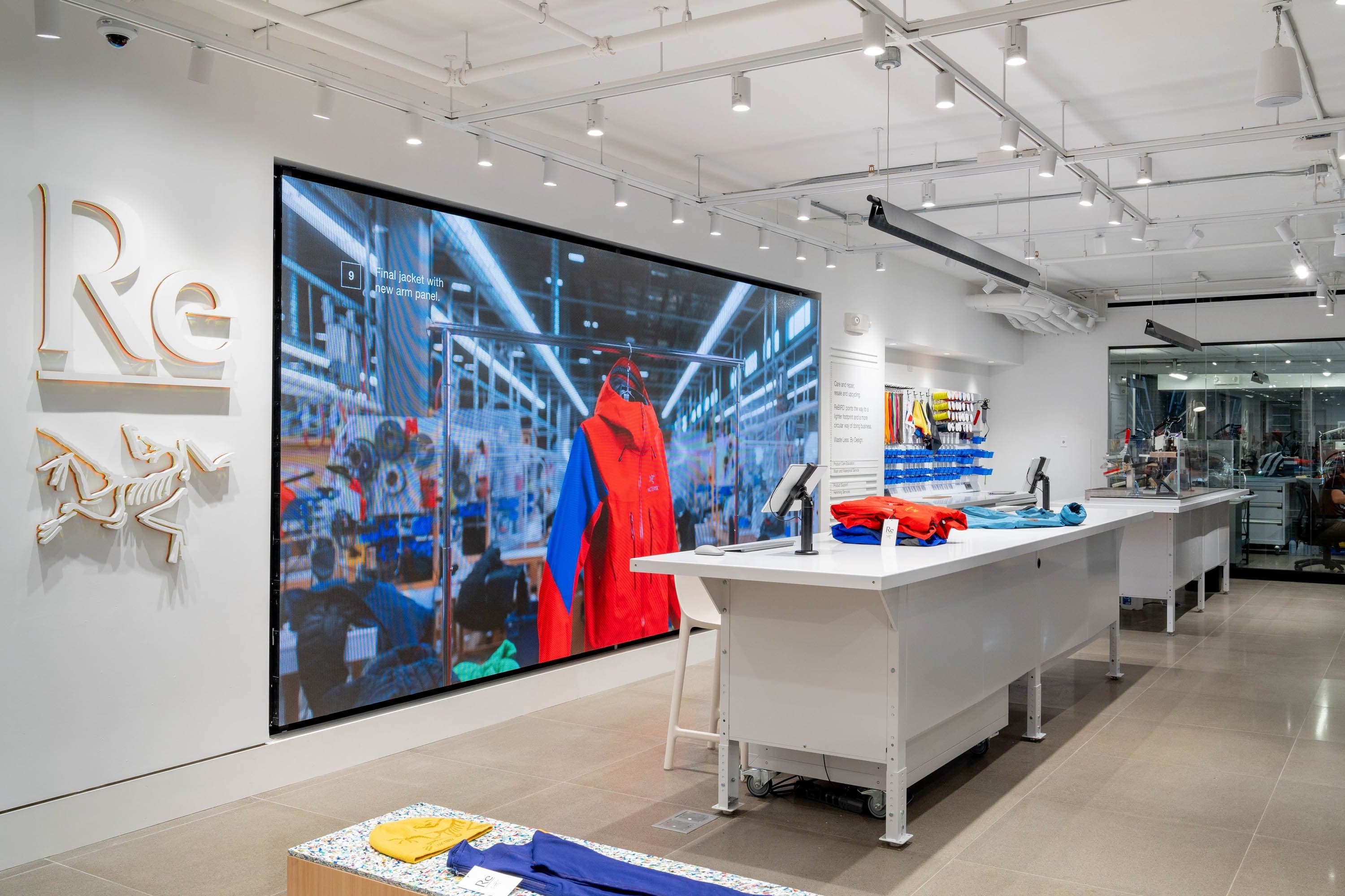 The ReBird area, with its logo, a large video screen and a long white counter
