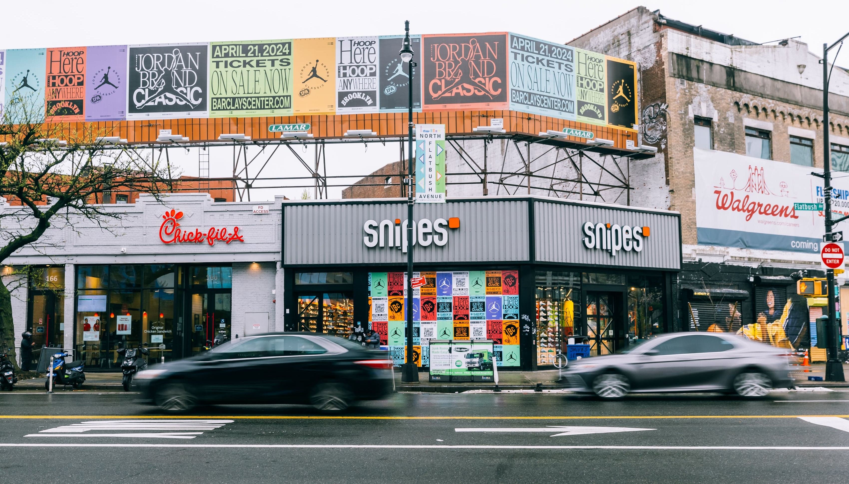 A street-corner storefront in Brooklyn wrapped in Jordan Brand Classic posters