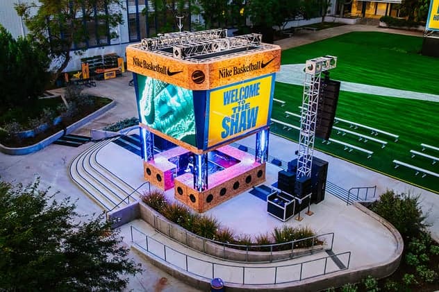 The “Welcome to The Shaw” tower above the school courtyard and stage