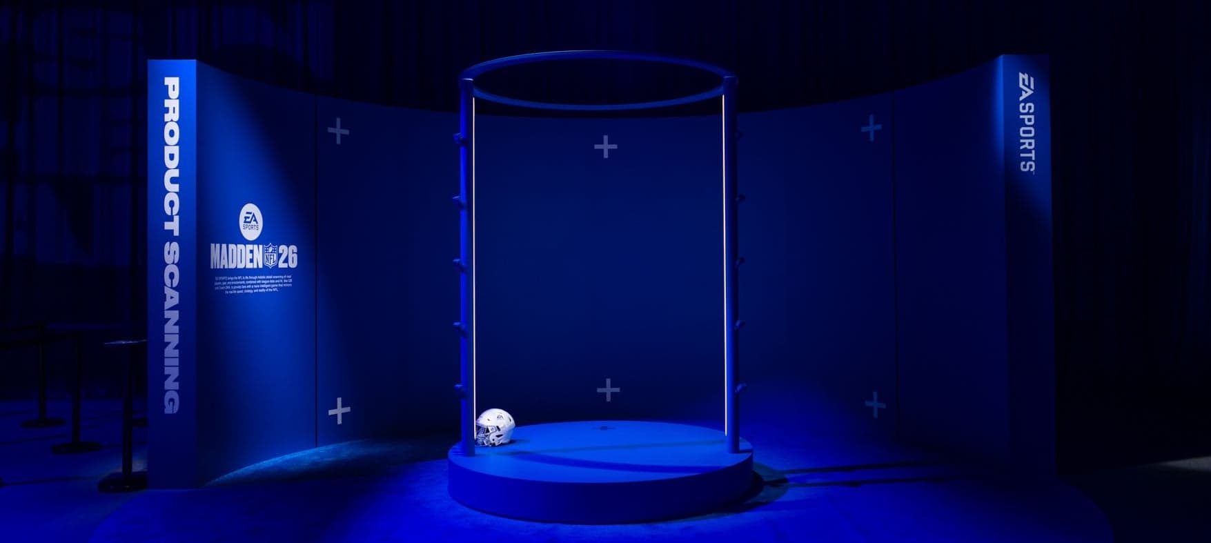 The Product Scanning booth: an empty cylindrical scanning rig on a round stage, framed by Madden NFL 26 and EA Sports panels