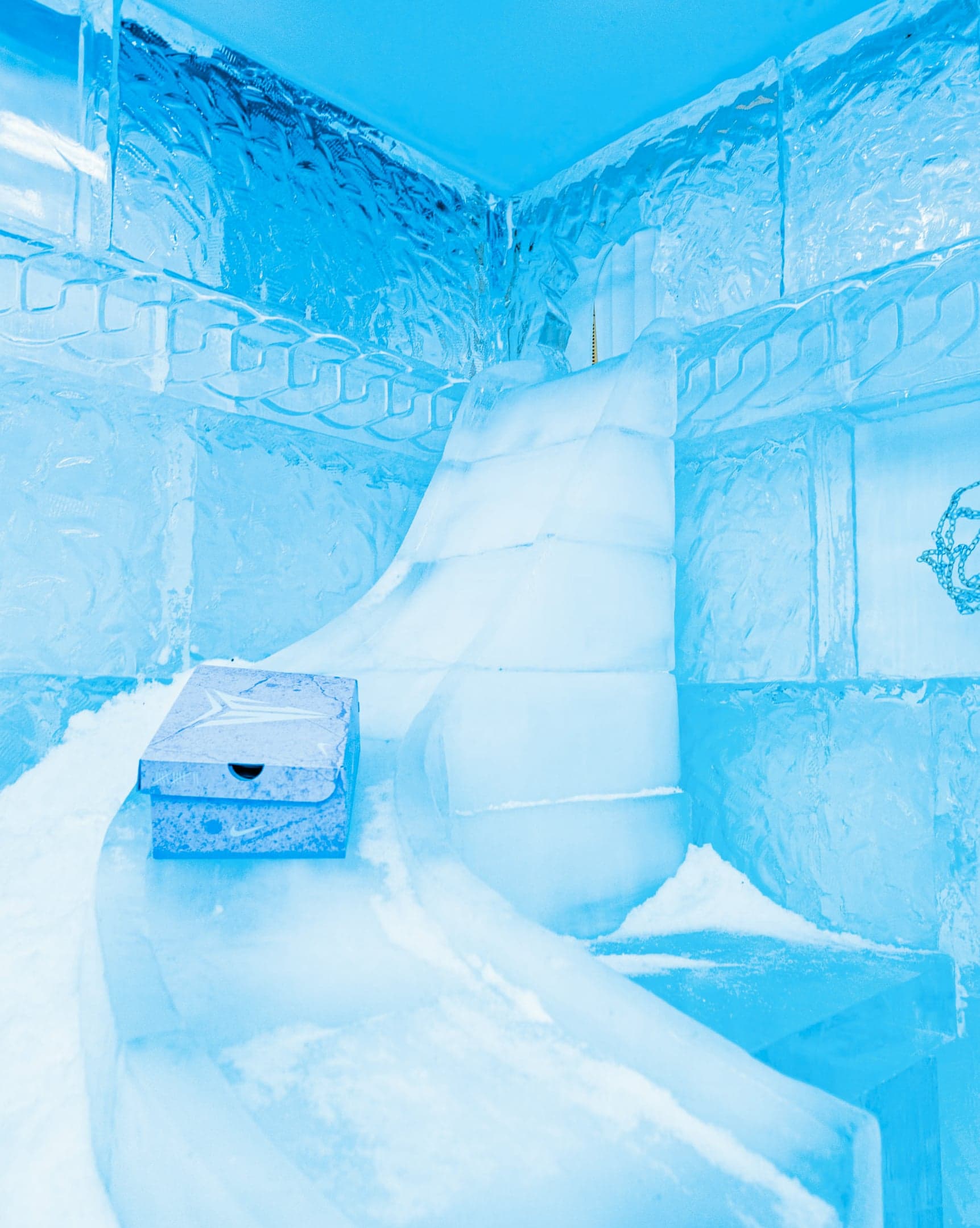 Inside the ice room: a snow ramp, a shoebox and a basketball hoop frozen in the wall