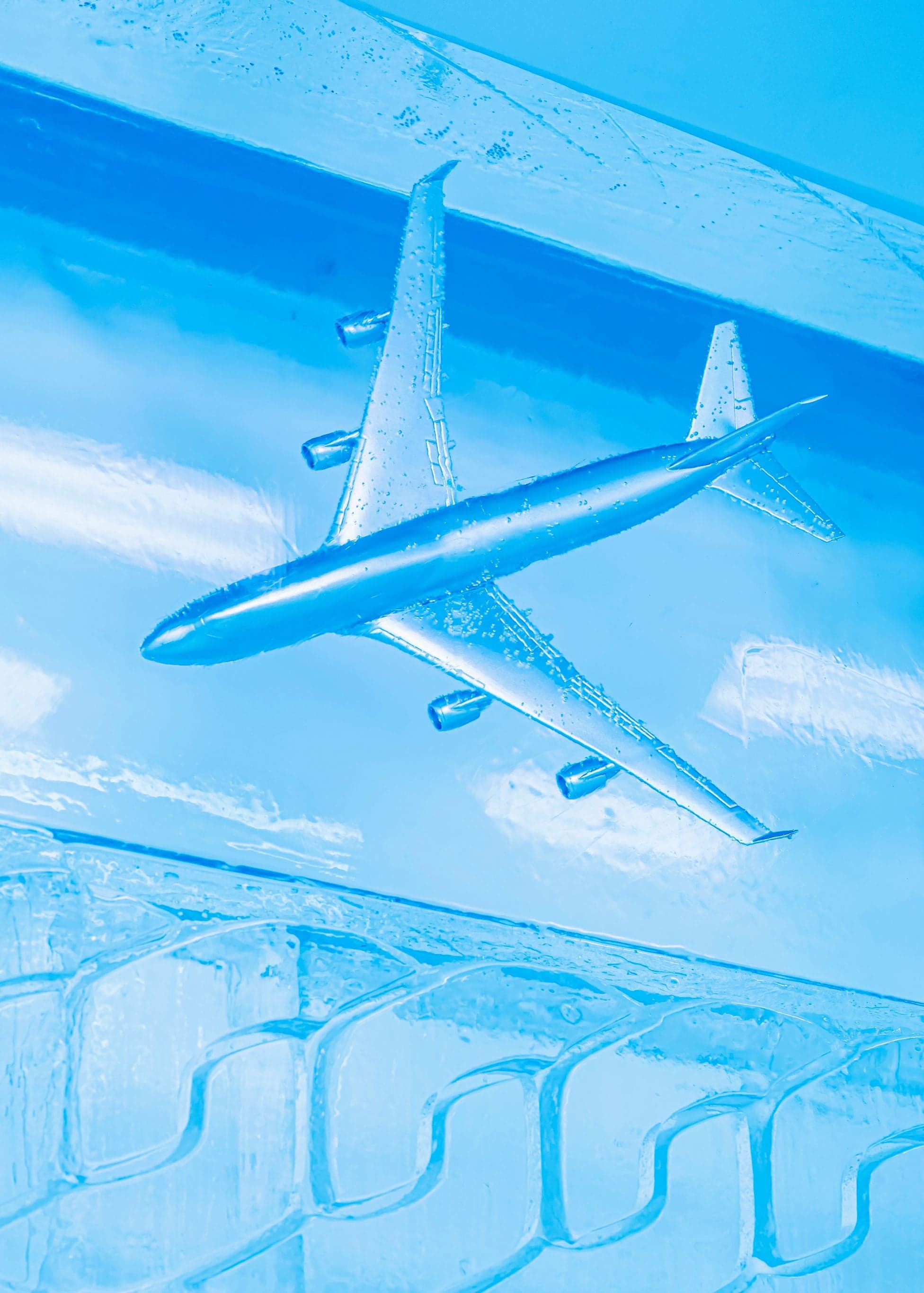 A model plane frozen in an ice wall