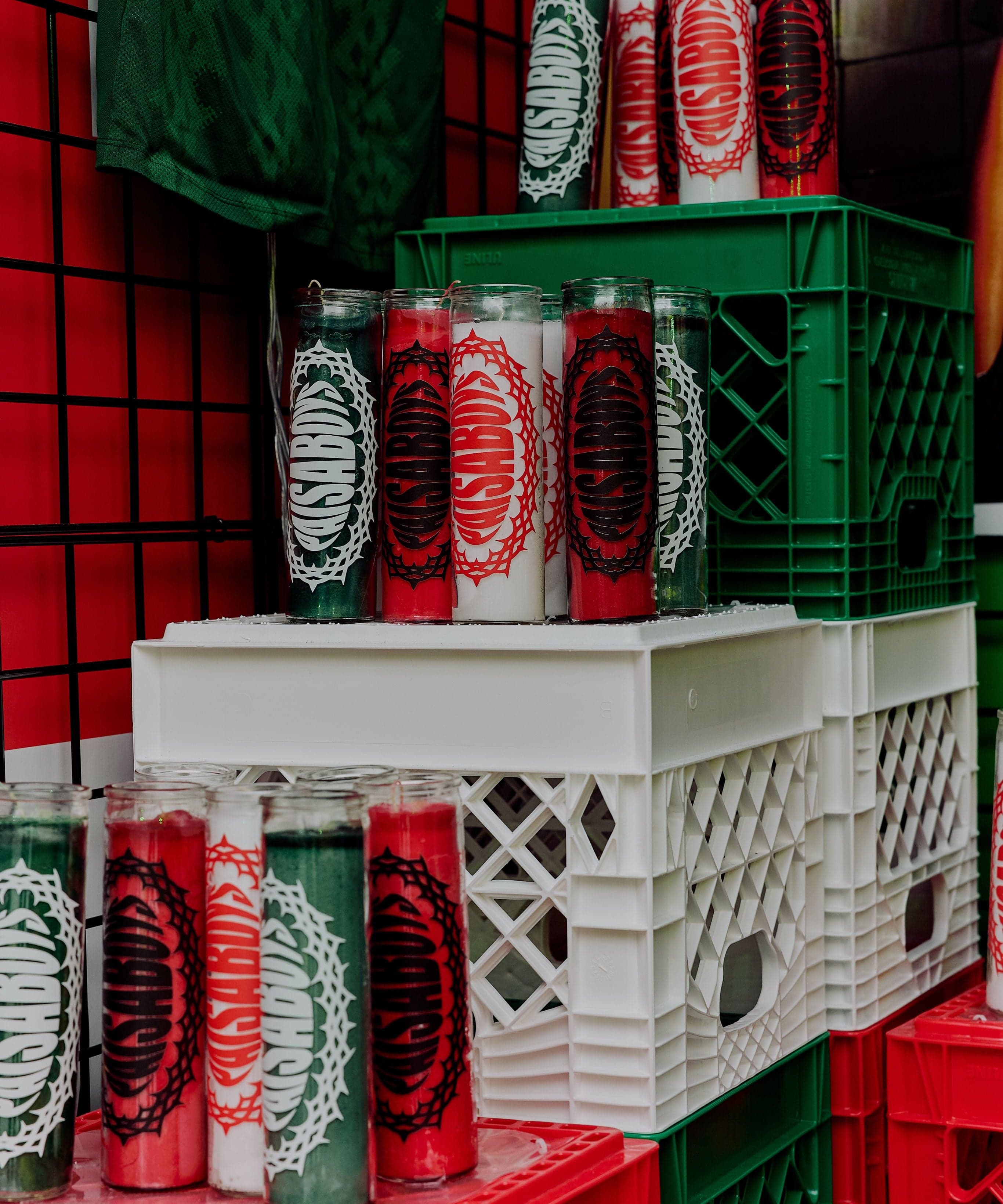 Paisa Boys cans stacked in red and white crates