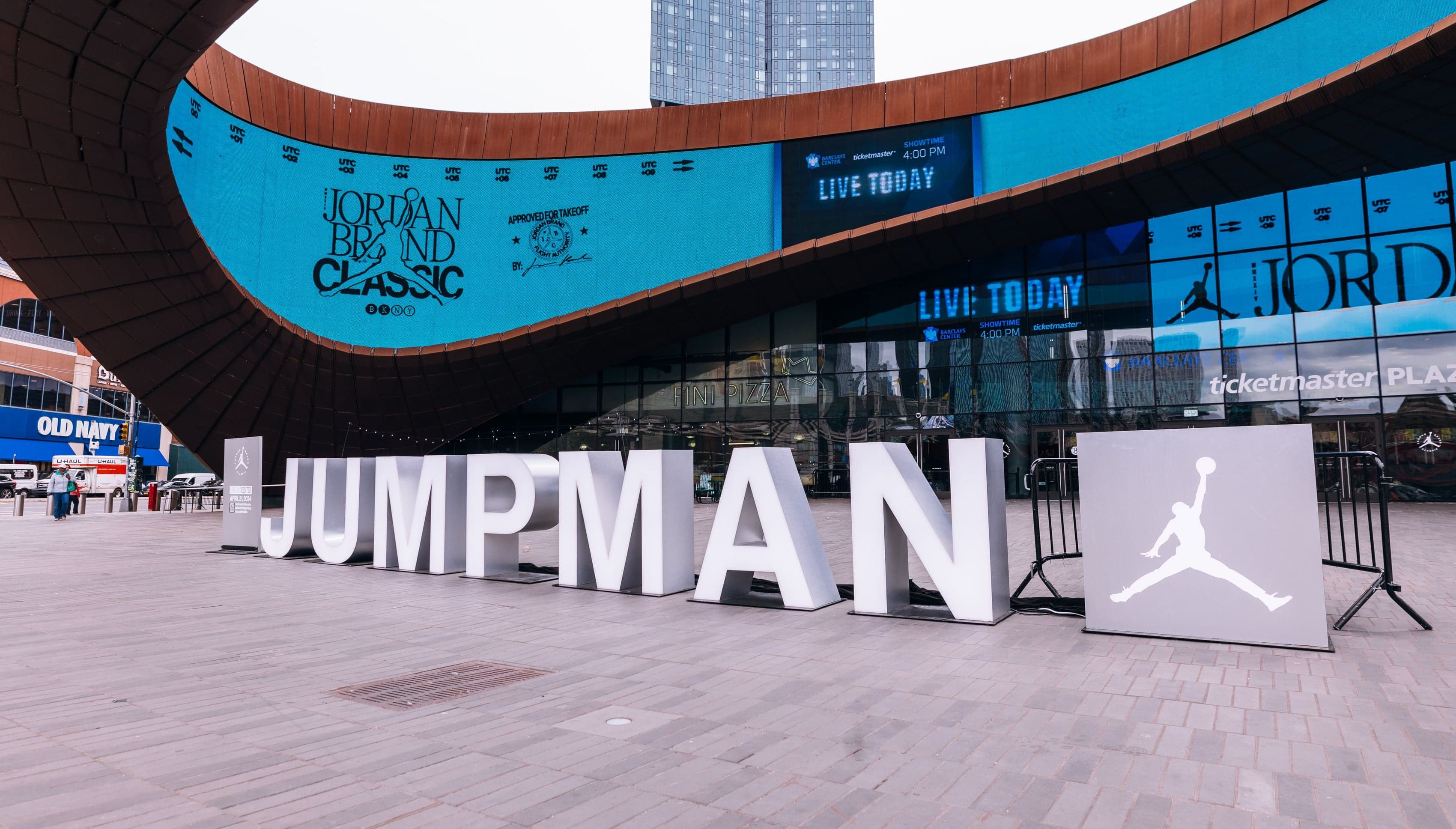 Giant white JUMPMAN letters and the Jordan logo on the plaza outside Barclays Center
