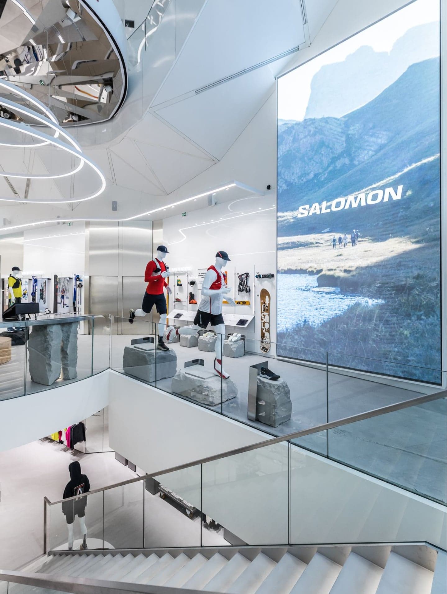 A tall Salomon mountain screen beside the staircase down to the lower floor