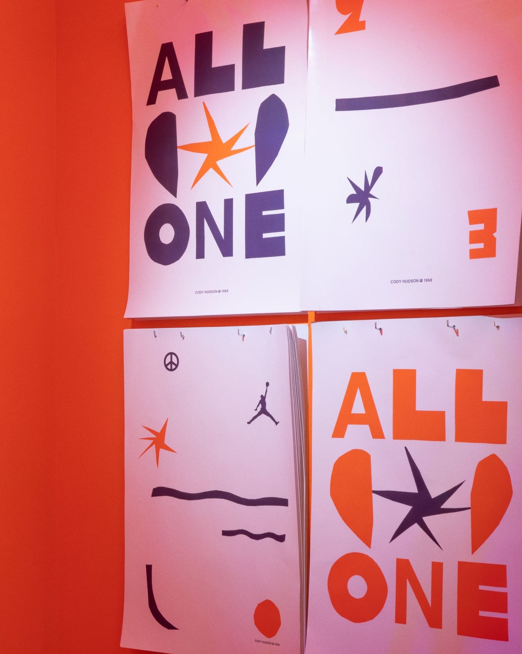 All Star One posters and an orange wall with the All Star One logo