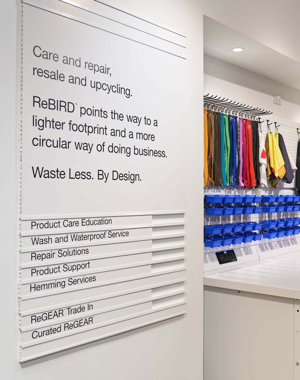 The ReBird care and repair wall, listing services beside a shelf of colourful gear
