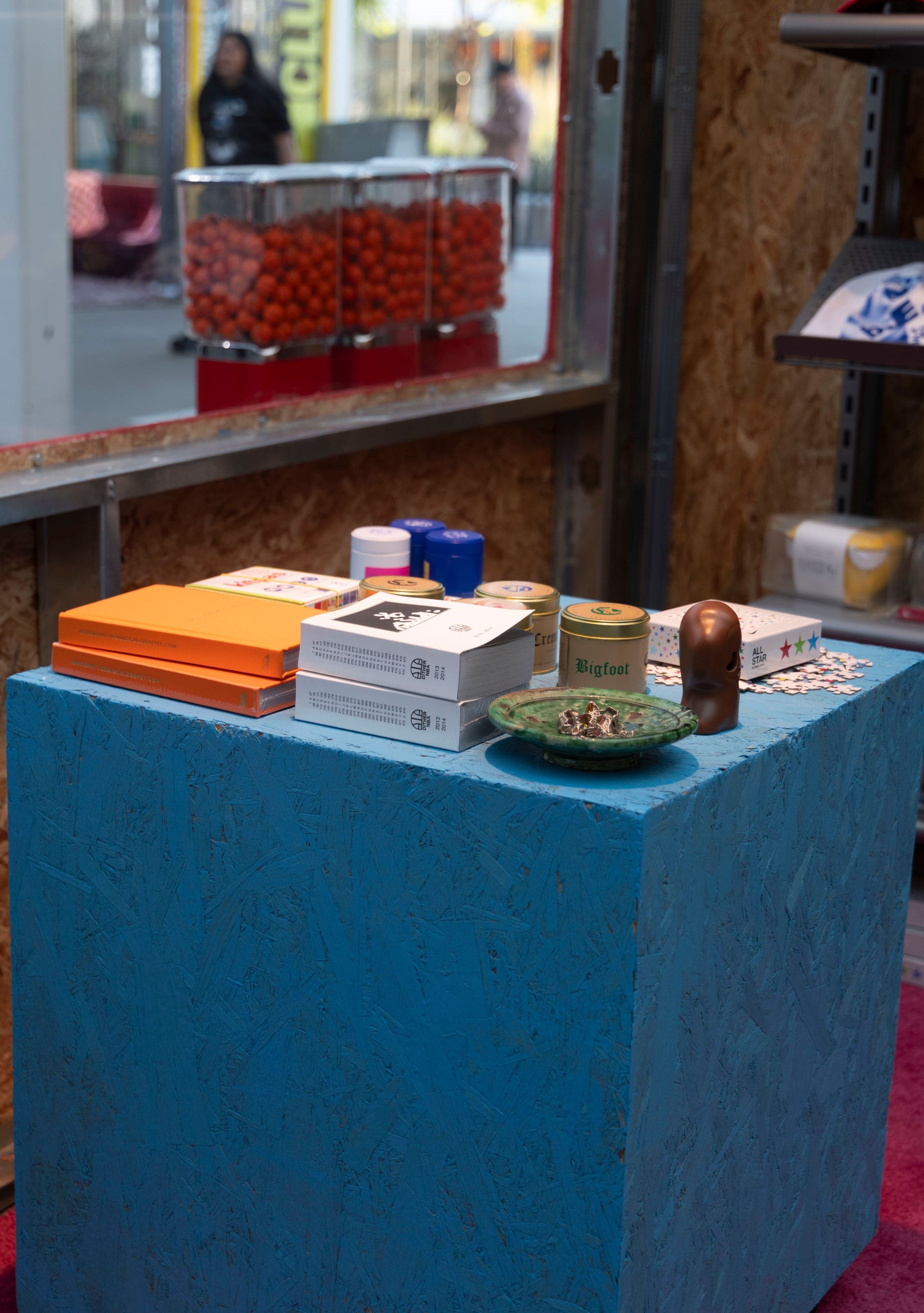 Books and merchandise displayed on a blue table