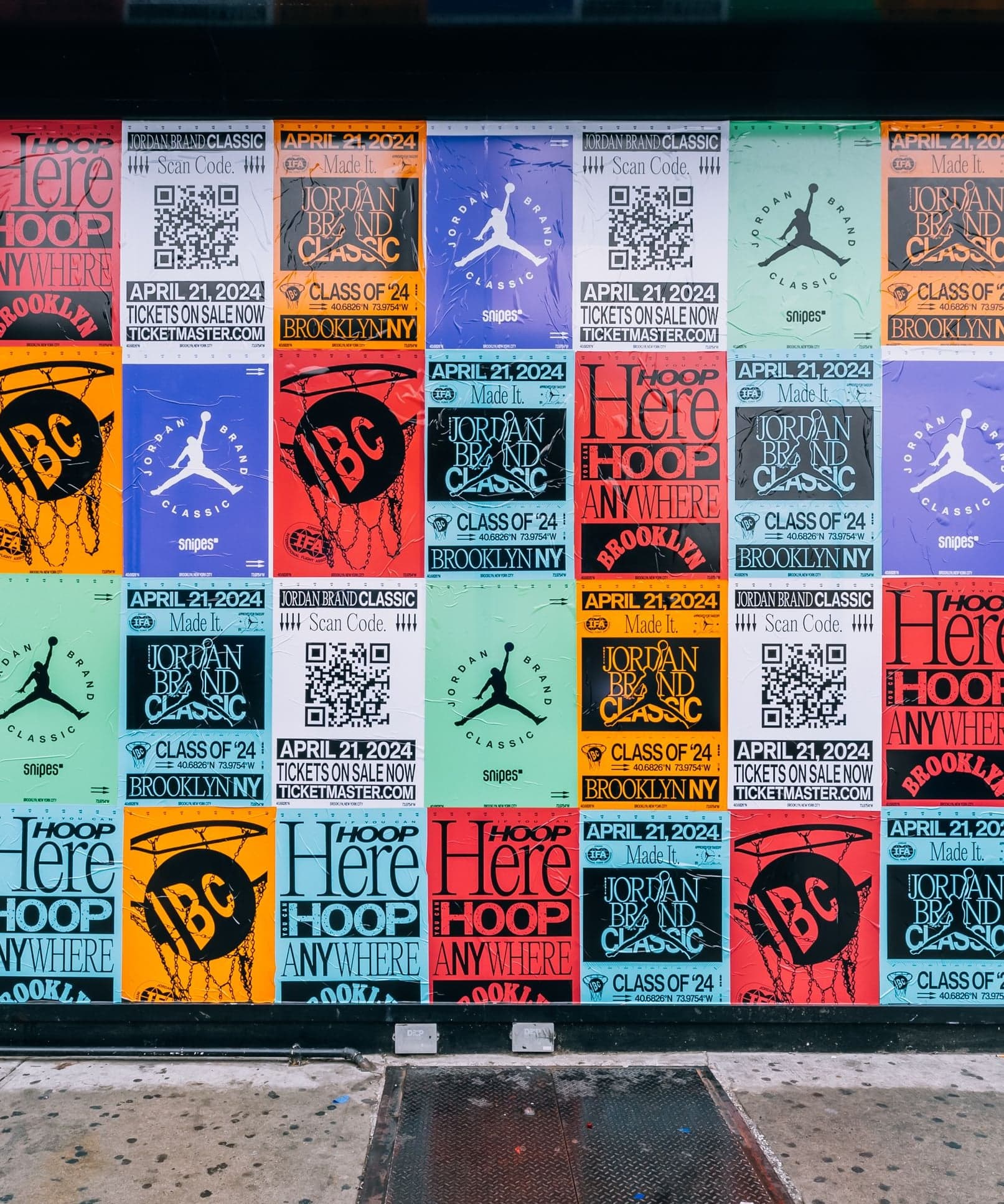 A wall of colorful Jordan Brand Classic posters with QR codes and Jumpman logos