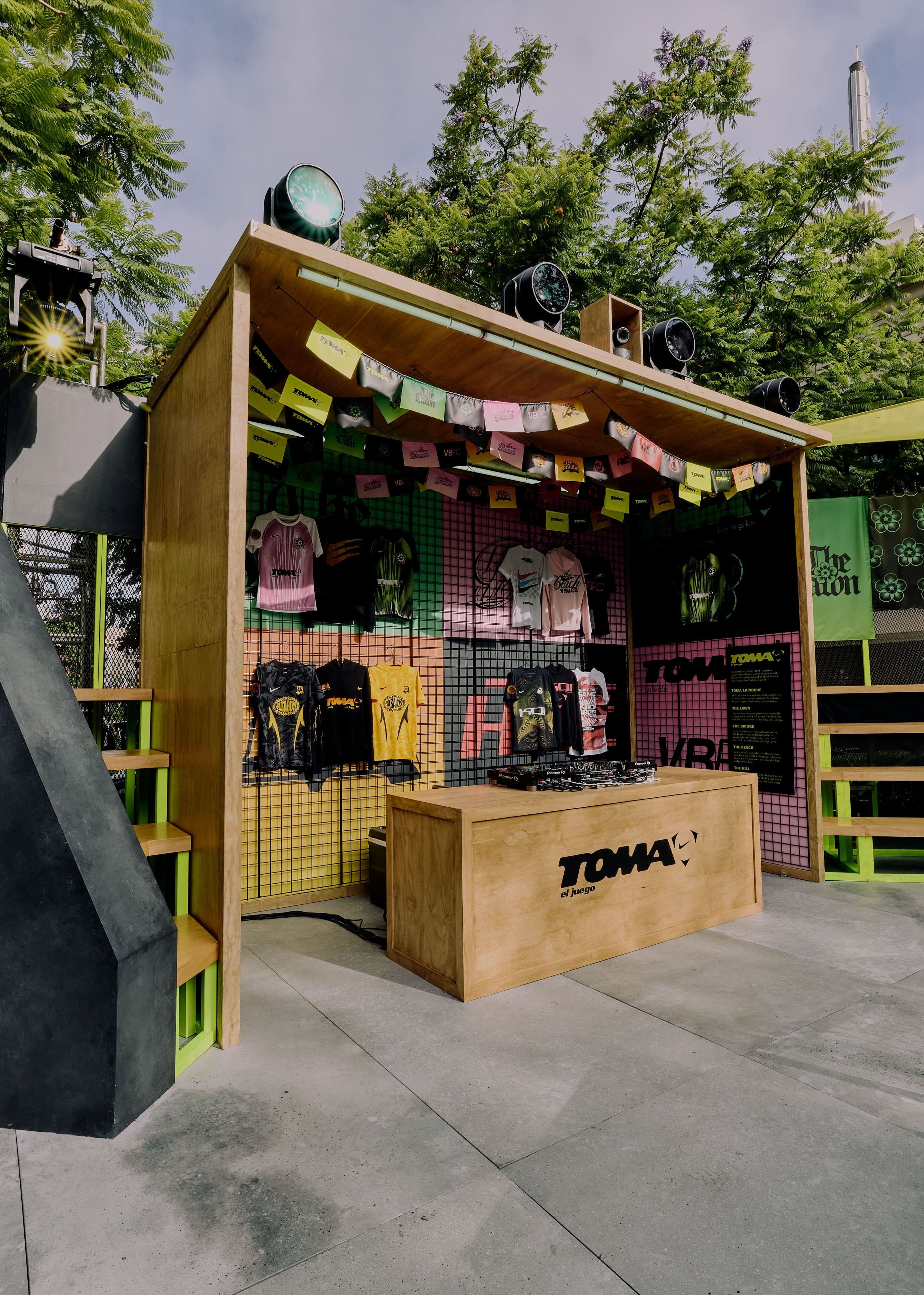 A wooden merch booth in the stadium corner