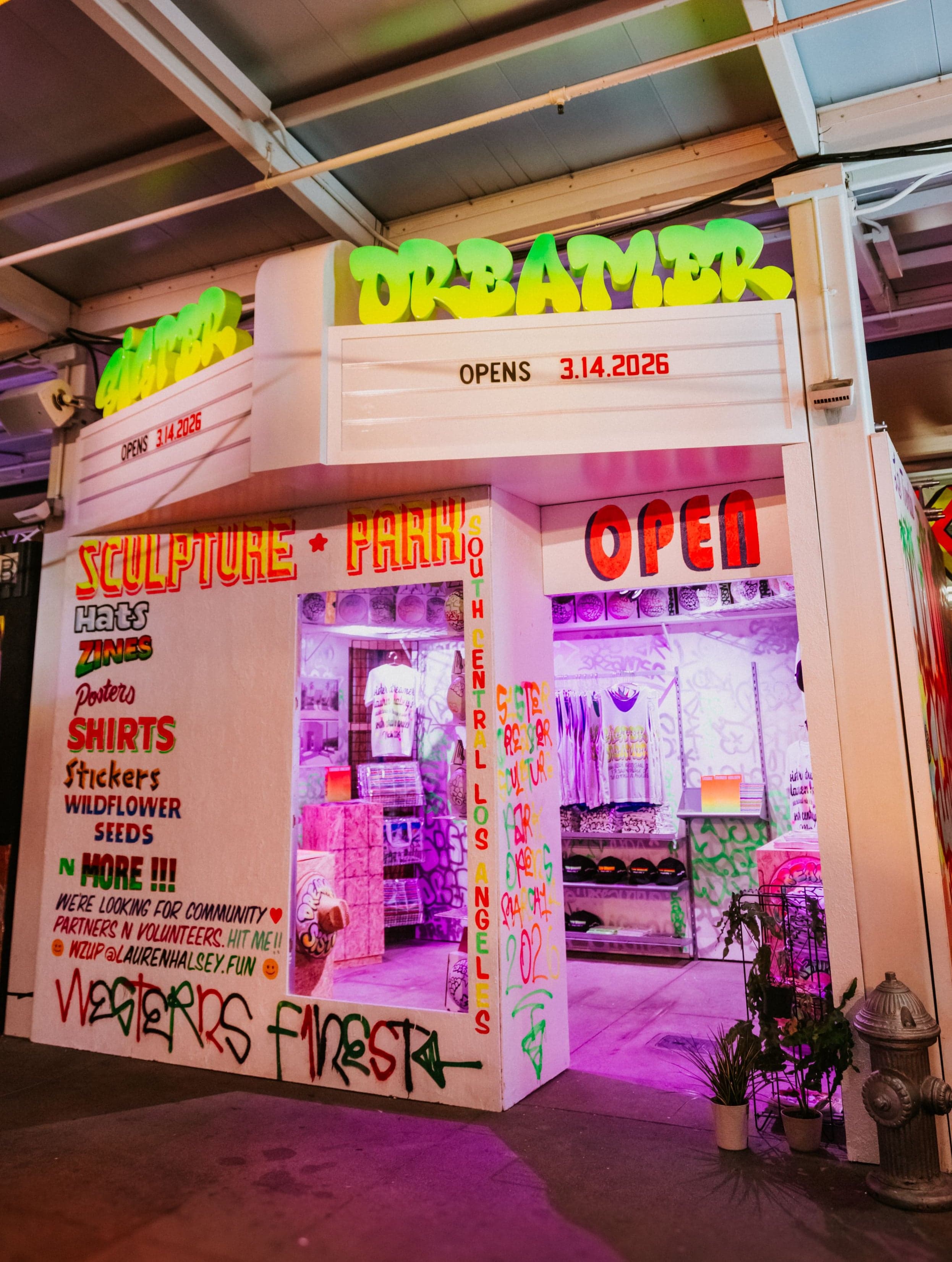 A small night market storefront covered in hand-painted signs