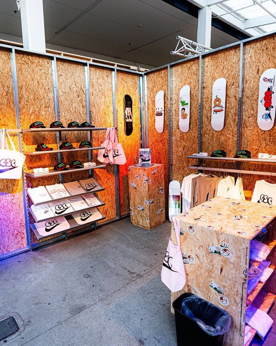 Inside the skate shop: plywood walls lined with skate decks and shoes