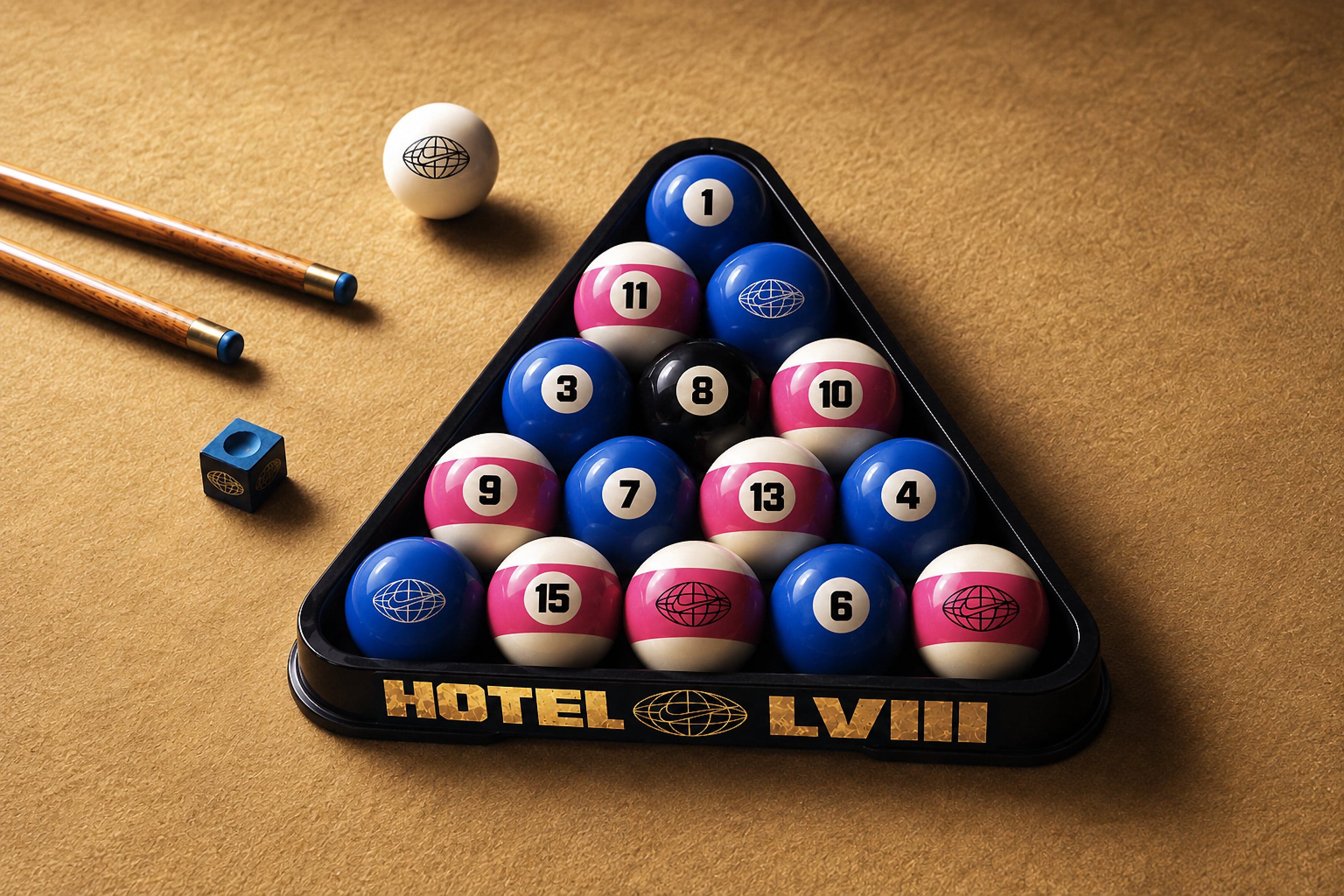 Pool balls in a Hotel LVIII rack, in Hotel LVIII pink and blue, beside cues and chalk