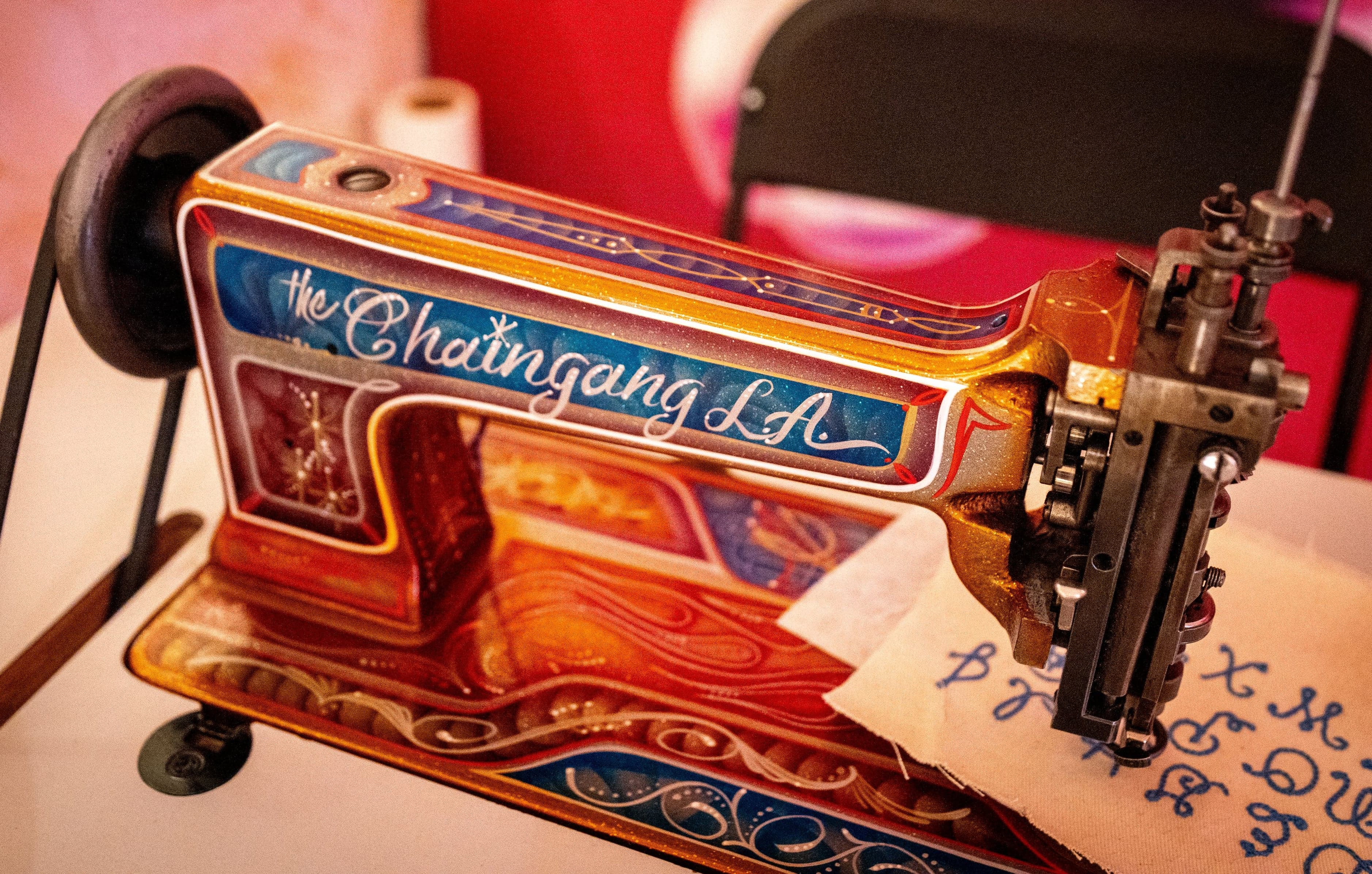 A vintage sewing machine painted with “The Chaingang LA” lettering