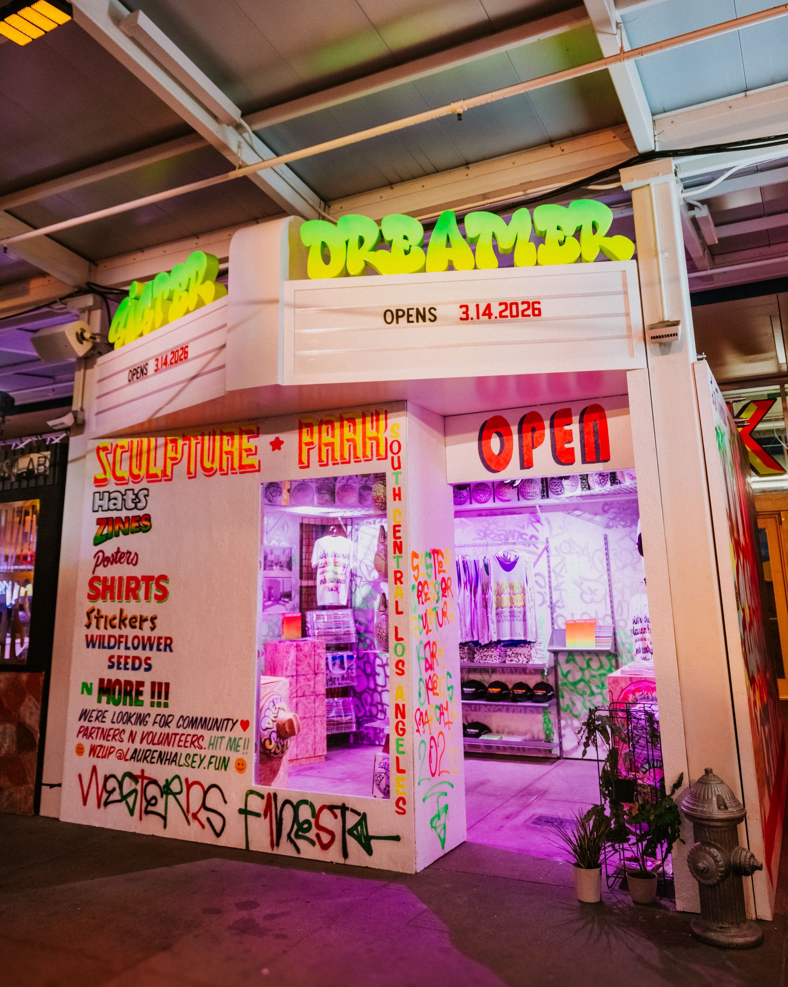 A small night market storefront covered in hand-painted signs